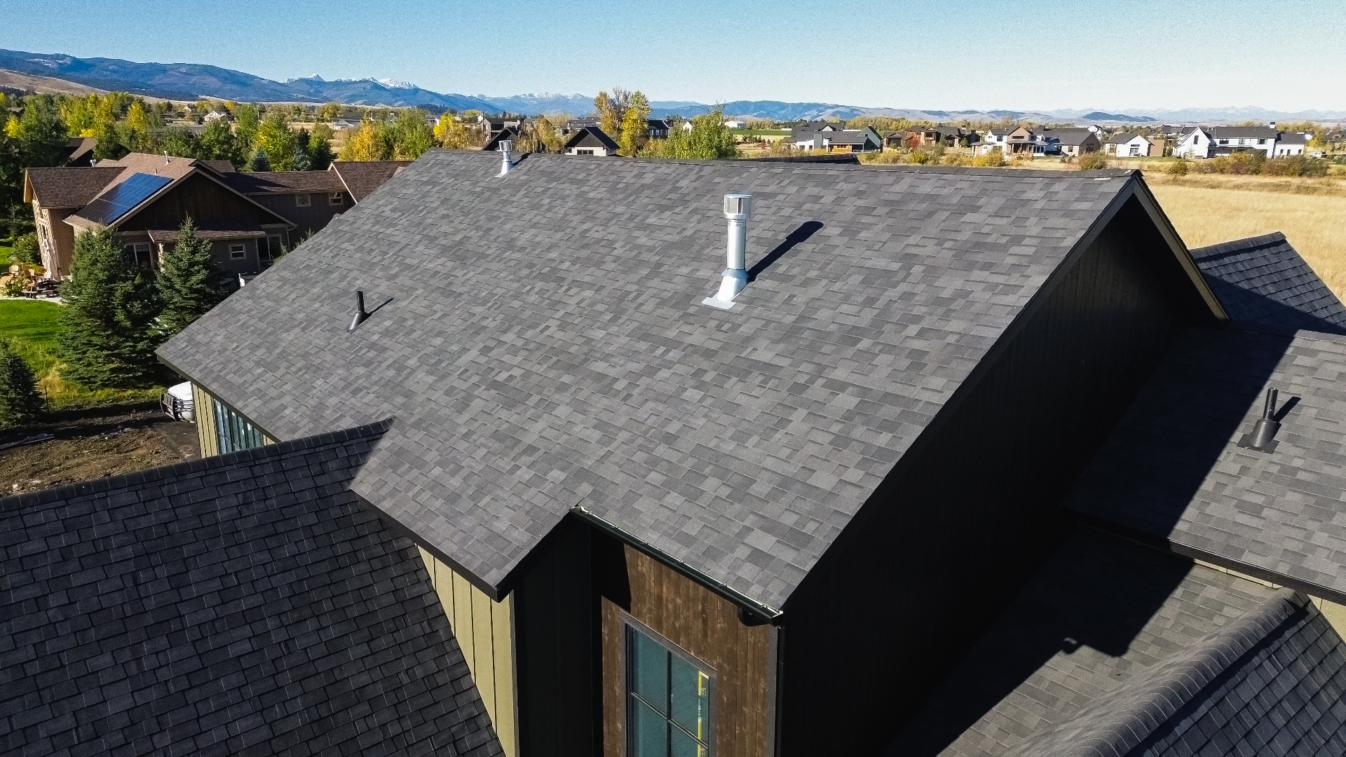 Close-up of finished shingle field and ridge