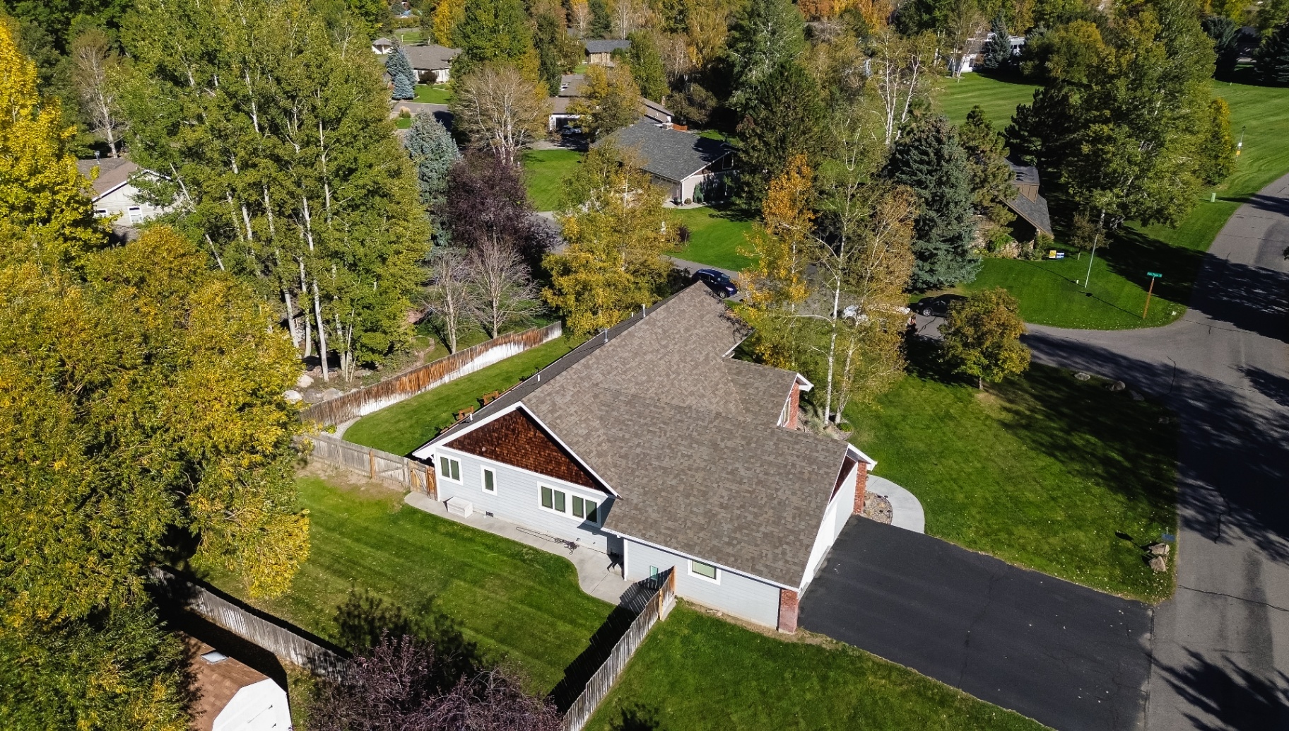 Side aerial of ranch home with new roof