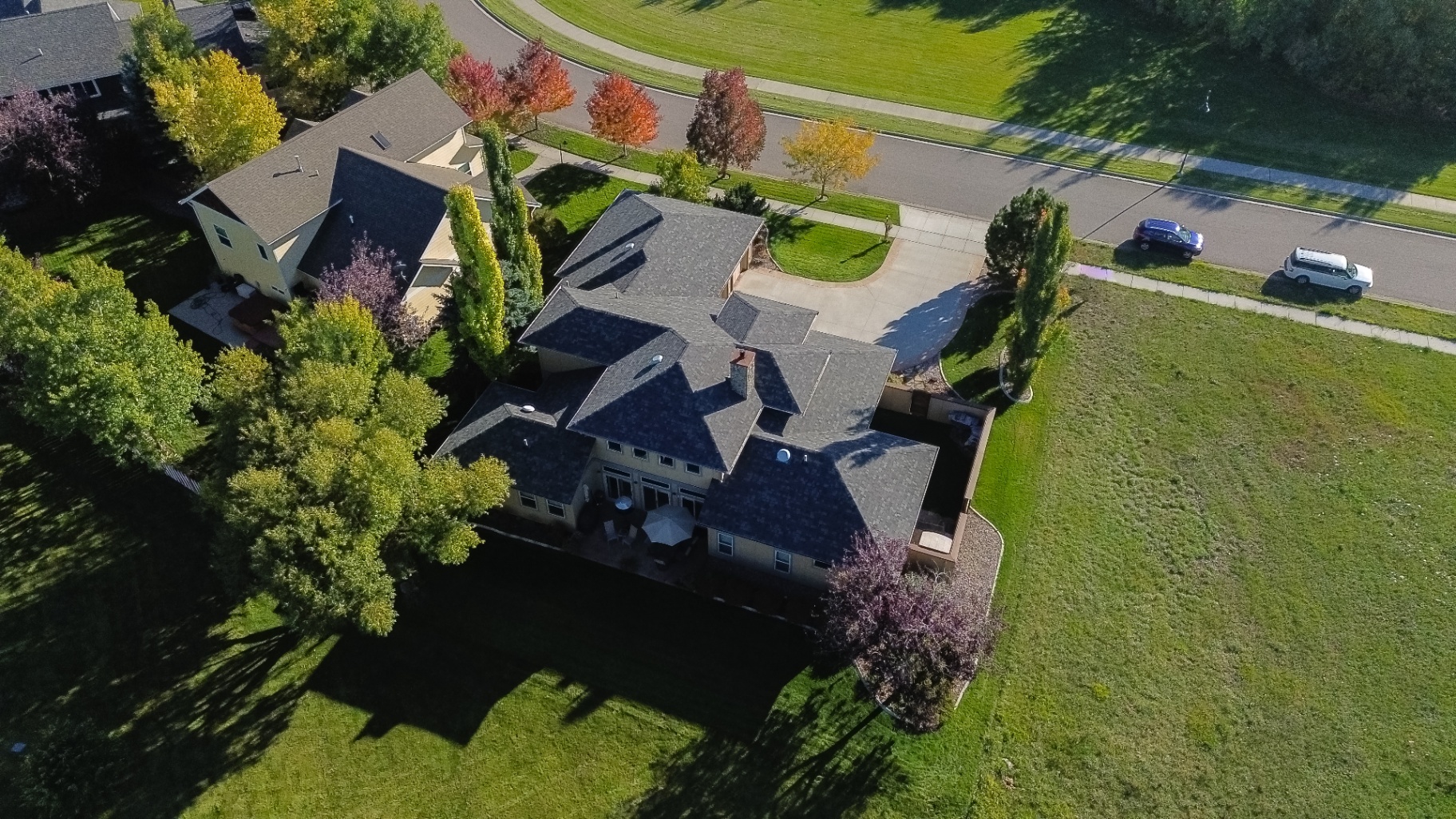 Wide aerial showing driveway and roof
