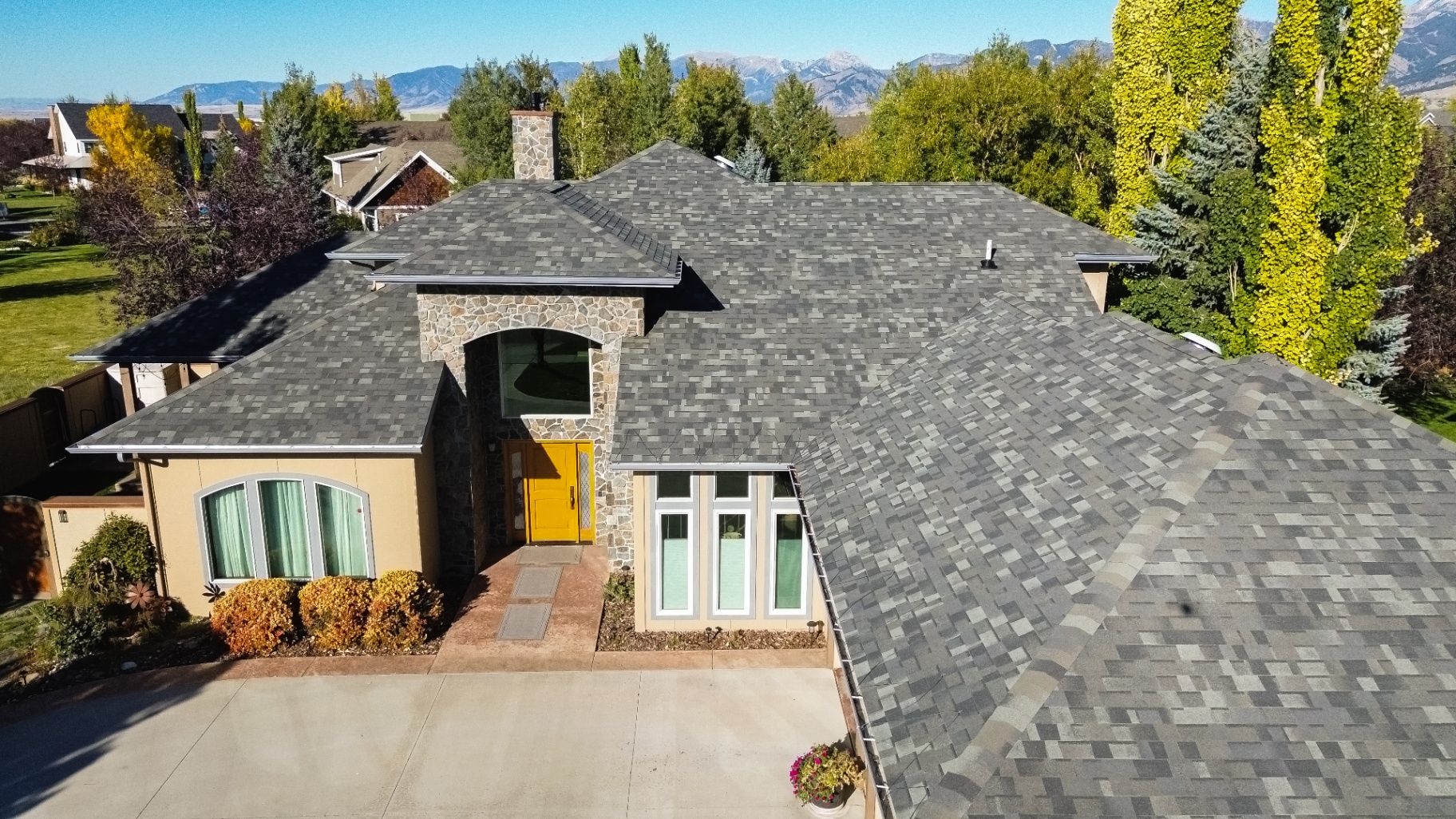 Stone-accent entry with new architectural shingles