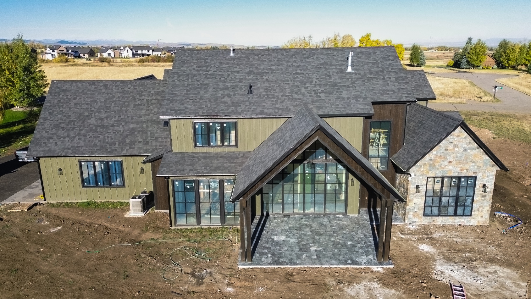 Custom Bozeman home with new architectural shingles — front elevation