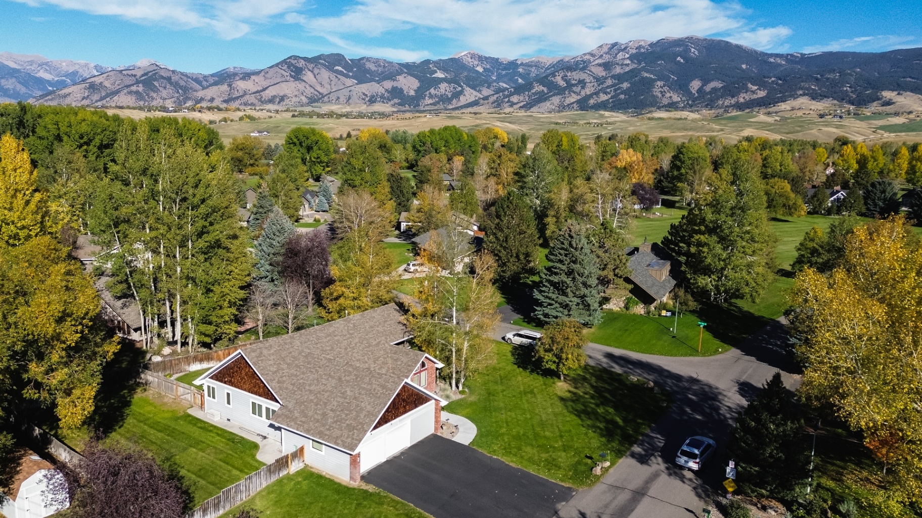 Mountain-view aerial of completed roof replacement